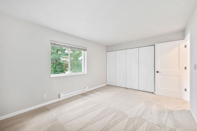 1508 Whispering Pines Way, Fitchburg, WI 53713 - unfurnished bedroom with baseboard heating, carpet floors, and a closet