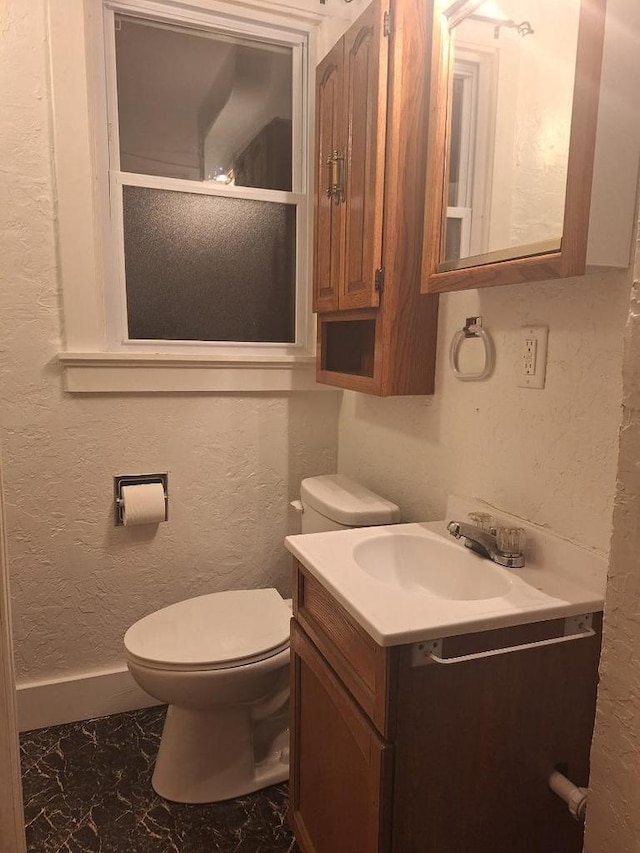 1326 N 11th St, Sheboygan, WI 53081 - half bath with vanity, marble finish floors, and a textured wall