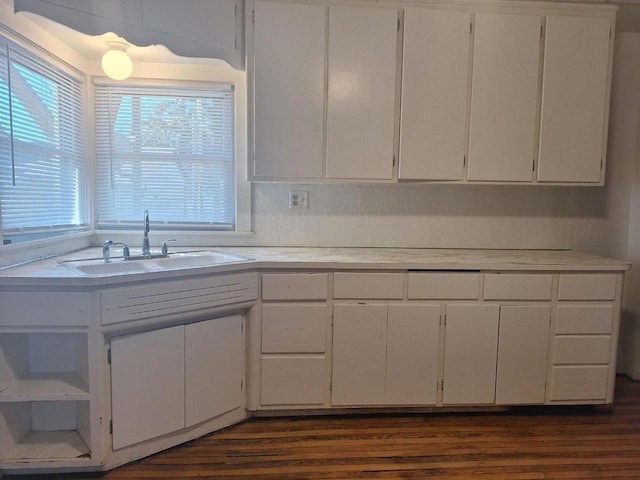 1326 N 11th St, Sheboygan, WI 53081 - kitchen featuring light countertops, white cabinets, and dark wood-style flooring