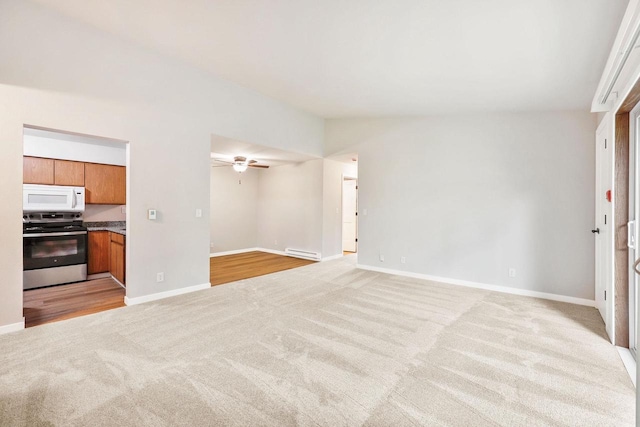 807 Whispering Pines Way, Fitchburg, WI 53713 - unfurnished living room featuring light colored carpet and a ceiling fan