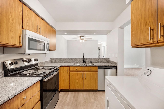 807 Whispering Pines Way, Fitchburg, WI 53713 - kitchen featuring electric range oven, washer / clothes dryer, dishwasher, light wood-style floors, and white microwave