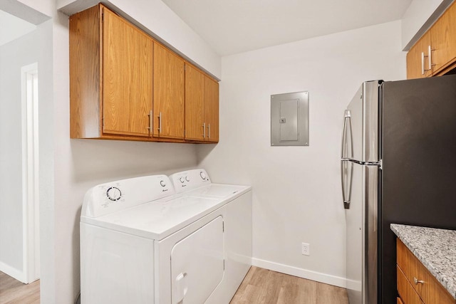 807 Whispering Pines Way, Fitchburg, WI 53713 - laundry area with electric panel, light wood-type flooring, and washer and dryer