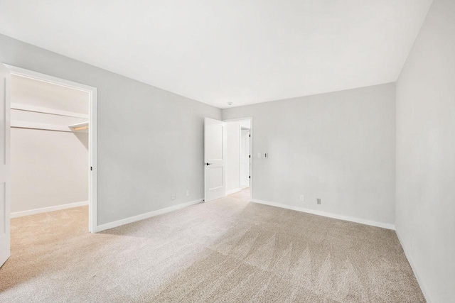 807 Whispering Pines Way, Fitchburg, WI 53713 - unfurnished bedroom featuring carpet flooring and a walk in closet