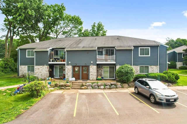 807 Whispering Pines Way, Fitchburg, WI 53713 - view of front facade with a balcony and uncovered parking