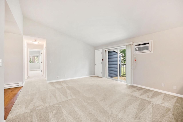 807 Whispering Pines Way, Fitchburg, WI 53713 - empty room featuring baseboard heating, a wall mounted air conditioner, healthy amount of natural light, light colored carpet, and vaulted ceiling