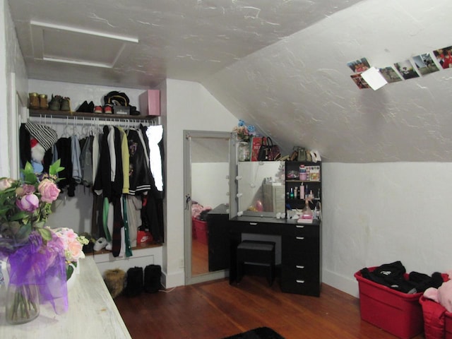 1744 N 27th St, Sheboygan, WI 53081 - bedroom featuring attic access, wood finished floors, vaulted ceiling, and a closet