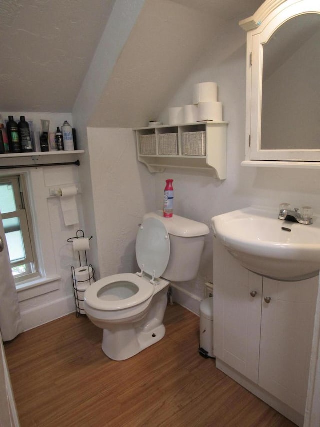 1744 N 27th St, Sheboygan, WI 53081 - half bath featuring lofted ceiling, vanity, and wood finished floors