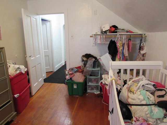 1744 N 27th St, Sheboygan, WI 53081 - bedroom with hardwood / wood-style floors and vaulted ceiling