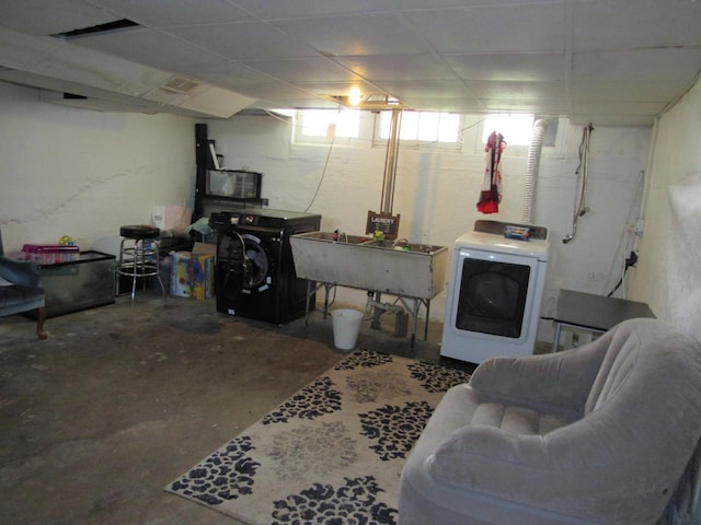 616 N 14th St, Sheboygan, WI 53081 - below grade area featuring independent washer and dryer and a drop ceiling