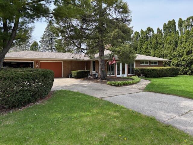 3415 N 105th St, Wauwatosa, WI 53222 - ranch-style house featuring a garage, a front lawn, and driveway