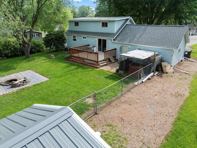 11165 Main St, Hewitt, WI 54441 - rear view of property featuring an outdoor fire pit, a wooden deck, and roof with shingles