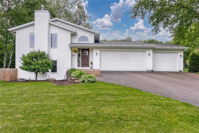 3713 Kingswood Ct, Eau Claire, WI 54701 - split level home with asphalt driveway, a garage, and a chimney