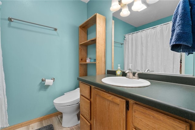 3713 Kingswood Ct, Eau Claire, WI 54701 - full bath with wood finished floors, vanity, and a shower with shower curtain