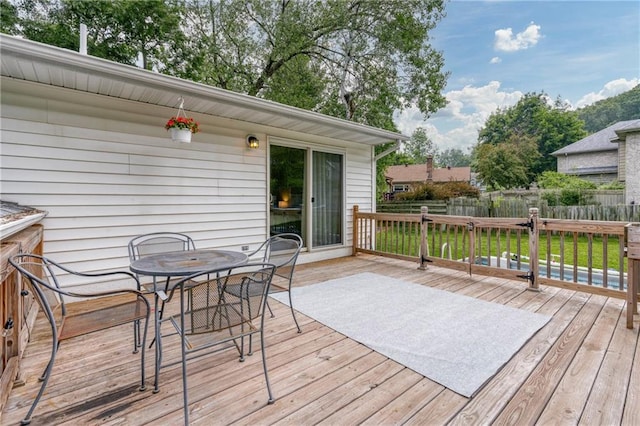 3713 Kingswood Ct, Eau Claire, WI 54701 - wooden deck featuring outdoor dining area
