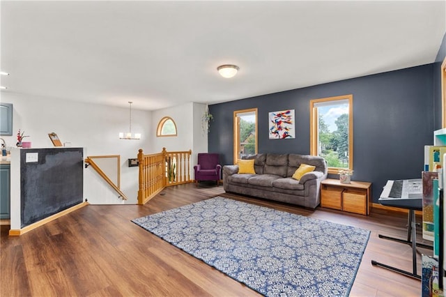 3713 Kingswood Ct, Eau Claire, WI 54701 - living area with wood finished floors and a chandelier