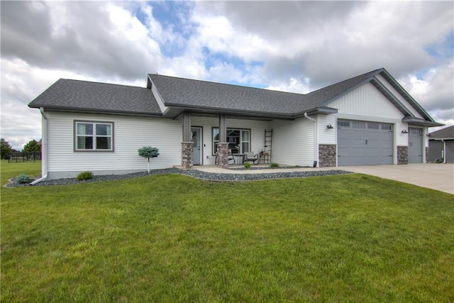 1040 Wissota Green Pkwy, Chippewa Falls, WI 54729 - view of front facade featuring covered porch, an attached garage, a front lawn, driveway, and a shingled roof