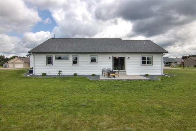 1040 Wissota Green Pkwy, Chippewa Falls, WI 54729 - rear view of property with a yard, a patio, and roof with shingles