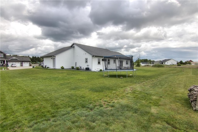 1040 Wissota Green Pkwy, Chippewa Falls, WI 54729 - rear view of property with a trampoline and a yard