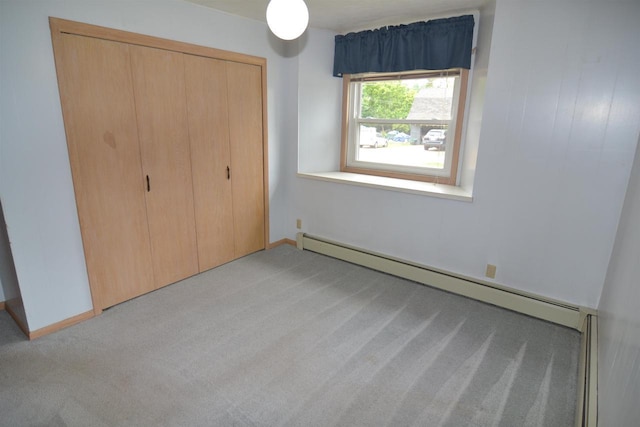 3917 Ross Ave, Weston, WI 54401 - unfurnished bedroom featuring light carpet, a baseboard heating unit, and a closet