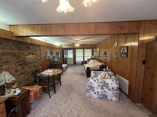 3917 Ross Ave, Weston, WI 54401 - living room featuring carpet flooring, wood walls, and ceiling fan