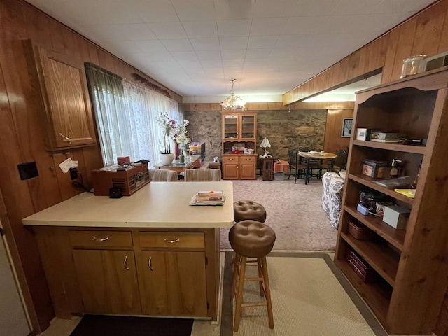 3917 Ross Ave, Weston, WI 54401 - kitchen with open floor plan, wooden walls, light countertops, light carpet, and a peninsula