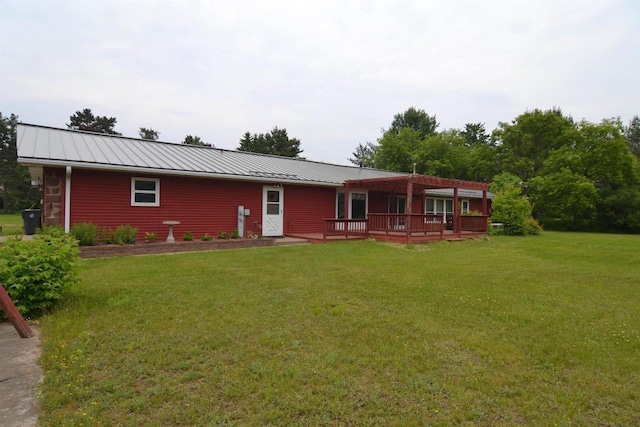 3917 Ross Ave, Weston, WI 54401 - view of front of property with a deck, a front yard, a standing seam roof, and a metal roof