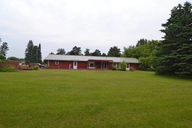 3917 Ross Ave, Weston, WI 54401 - view of front facade with a front yard and a metal roof