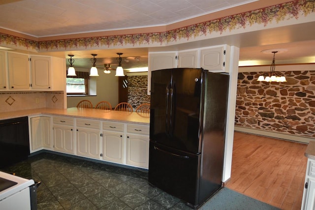 3917 Ross Ave, Weston, WI 54401 - kitchen with black appliances, hanging light fixtures, white cabinets, and light countertops