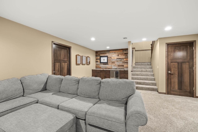 3830 Augusta Ct, Plover, WI 54467 - carpeted living room with beverage cooler, stairway, and recessed lighting
