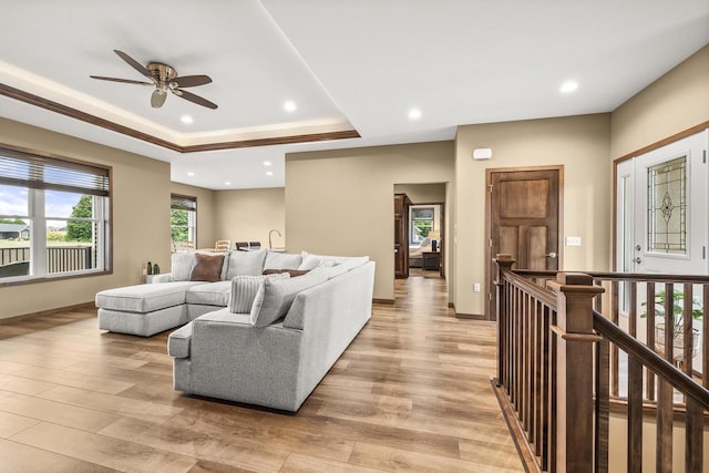 3830 Augusta Ct, Plover, WI 54467 - living area with light wood-style flooring, a ceiling fan, recessed lighting, and a raised ceiling