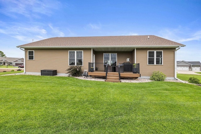 3830 Augusta Ct, Plover, WI 54467 - back of property with a deck, a yard, and a shingled roof