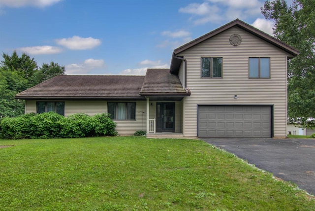 8103 W Folsom St, Eau Claire, WI 54703 - traditional-style house with a garage, driveway, a front yard, and a shingled roof