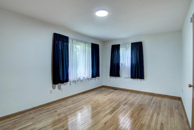 8103 W Folsom St, Eau Claire, WI 54703 - empty room featuring light wood finished floors and baseboards