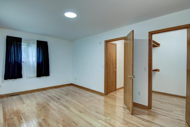 8103 W Folsom St, Eau Claire, WI 54703 - spare room featuring light wood finished floors and baseboards