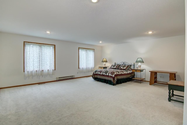 8103 W Folsom St, Eau Claire, WI 54703 - carpeted bedroom with a baseboard heating unit and recessed lighting