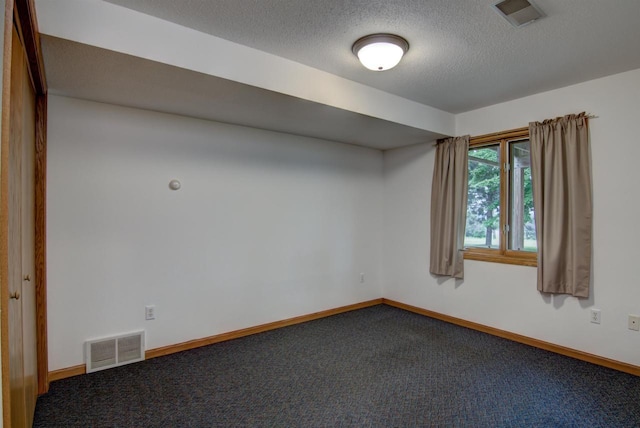 8103 W Folsom St, Eau Claire, WI 54703 - empty room featuring carpet and a textured ceiling