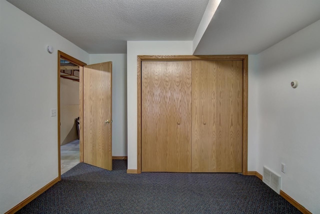 8103 W Folsom St, Eau Claire, WI 54703 - unfurnished bedroom featuring carpet flooring, a closet, and a textured ceiling