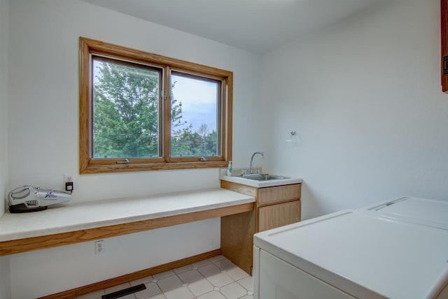 8103 W Folsom St, Eau Claire, WI 54703 - laundry area featuring independent washer and dryer, cabinet space, and light flooring