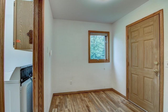 8103 W Folsom St, Eau Claire, WI 54703 - foyer with washing machine and clothes dryer and light wood finished floors