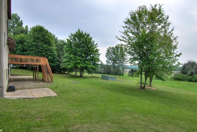8103 W Folsom St, Eau Claire, WI 54703 - view of grassy yard featuring stairs and a deck