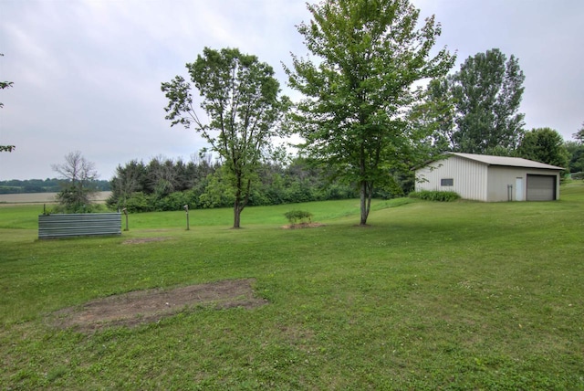 8103 W Folsom St, Eau Claire, WI 54703 - view of green lawn featuring a garage and an outdoor structure