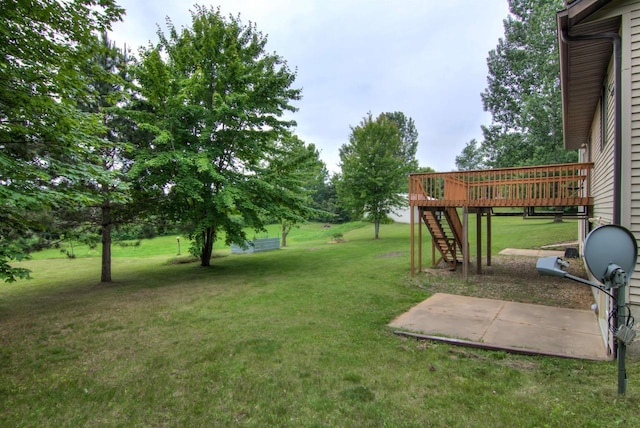 8103 W Folsom St, Eau Claire, WI 54703 - view of grassy yard featuring stairway, a deck, and a patio area