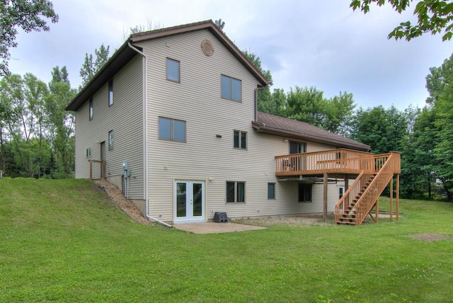 8103 W Folsom St, Eau Claire, WI 54703 - back of property with stairs, french doors, a wooden deck, a yard, and a patio area