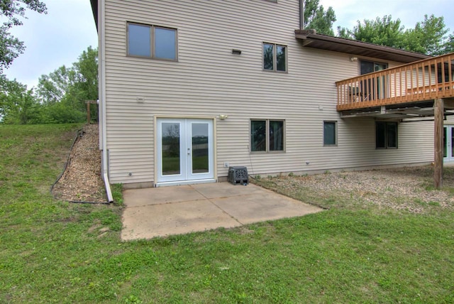 8103 W Folsom St, Eau Claire, WI 54703 - rear view of property with a yard, a patio area, a deck, and french doors
