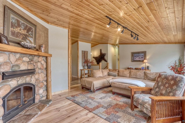 7760 N Thunder Point Rd, Hayward, WI 54843 - living area with wood ceiling, wood-type flooring, rail lighting, and a fireplace