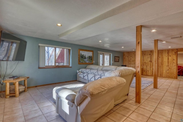 7760 N Thunder Point Rd, Hayward, WI 54843 - living area featuring recessed lighting, light tile patterned flooring, and wood walls