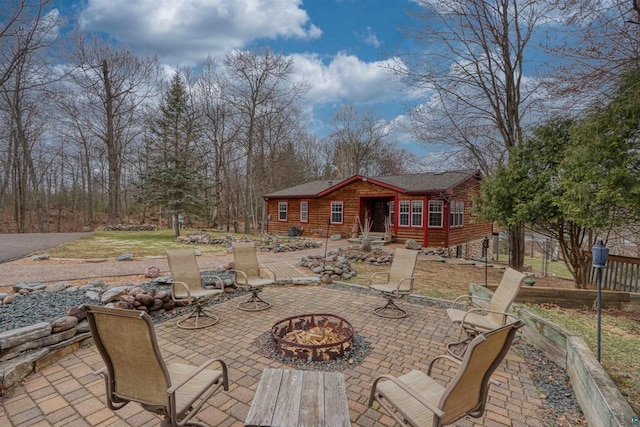 7760 N Thunder Point Rd, Hayward, WI 54843 - view of patio / terrace with an outdoor fire pit