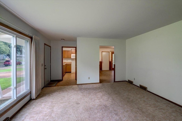 1702 Rae Ln, Madison, WI 53711 - unfurnished bedroom featuring light colored carpet and multiple windows