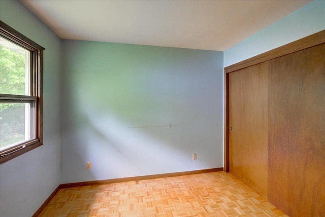 1702 Rae Ln, Madison, WI 53711 - unfurnished bedroom featuring multiple windows and a closet