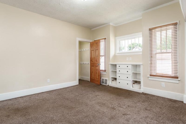 619 Middle St, Beloit, WI 53511 - unfurnished bedroom with dark colored carpet and crown molding